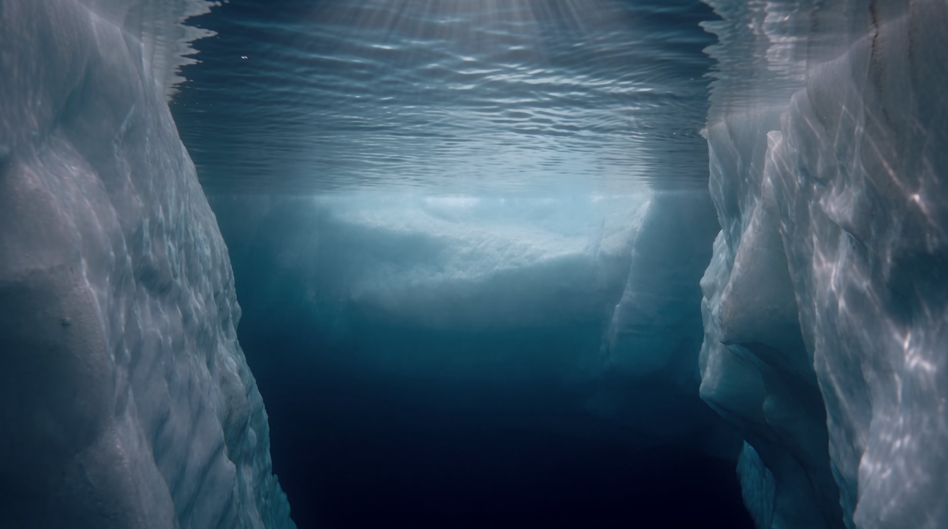 Inside a narrow ice corridor below the surface, walls close on both sides.
